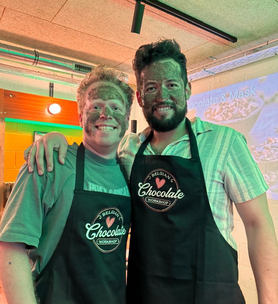 people in aprons taking a chocolate class in brussels